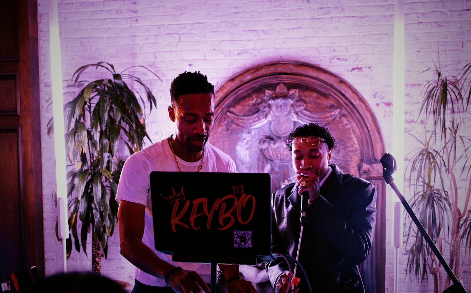 DJ Keybo at the decks with an MC on the mic